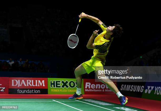 Shi Yuqi of China competes against Viktor Axelsen of Denmark during the Men's Singles Semi-final match on day five of the Blibli Indonesia Open at...