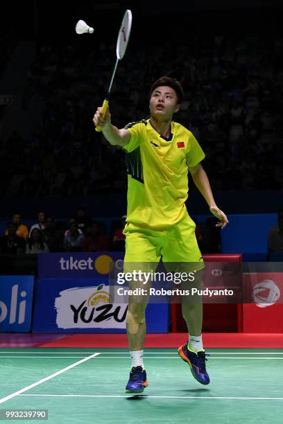 Shi Yuqi of China competes against Viktor Axelsen of Denmark during the Men's Singles Semi-final match on day five of the Blibli Indonesia Open at...