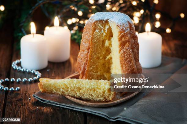 christmas cake pandoro on the wooden table - süßes brot stock-fotos und bilder