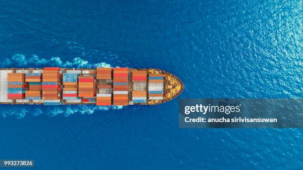 aerial top view container ship runing have wave in green sea, bangkok, thailand. - container stock-fotos und bilder