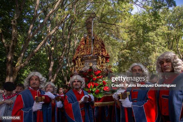 Men carry a figure of San Fermin during the San Fermin procession on the second day of the San Fermin Running of the Bulls festival on July 7, 2018...