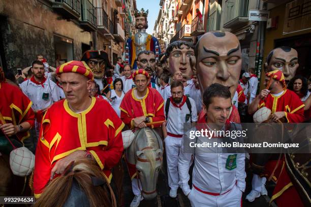 Kilikis, big heads amid revellers take part in the Comparsa de Gigantes y Cabezudos, or Giants and Big Heads parade on the second day of the San...