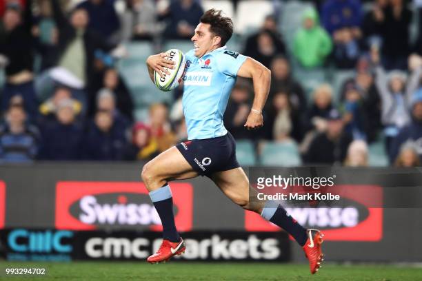 Nick Phipps of the Waratahs breaks away to score a try during the round 18 Super Rugby match between the Waratahs and the Sunwolves at Allianz...