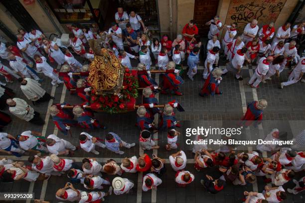 Men carry a figure of San Fermin during the San Fermin procession on the second day of the San Fermin Running of the Bulls festival on July 7, 2018...