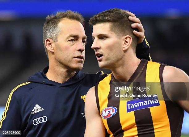 Luke Breust of the Hawks is congratulated by Hawks head coach Alastair Clarkson after kicking 6 goals during the round 16 AFL match between the...