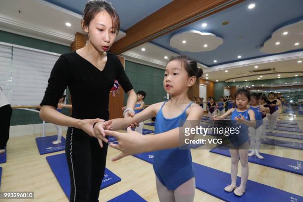 Children attend basic dance training at a dance training center on July 4, 2018 in Xiangyang, Hubei Province of China. Many Chinese children in...