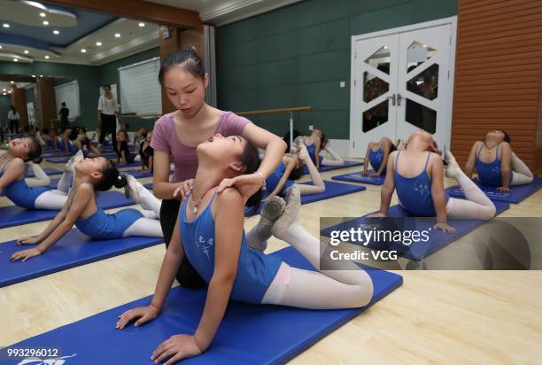 Children attend basic dance training at a dance training center on July 4, 2018 in Xiangyang, Hubei Province of China. Many Chinese children in...