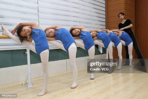 Children attend basic dance training at a dance training center on July 4, 2018 in Xiangyang, Hubei Province of China. Many Chinese children in...