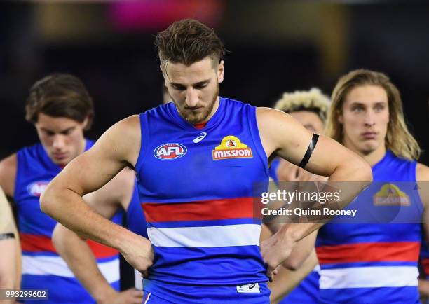 Marcus Bontempelli and his Bulldogs team mates look dejected after losing the round 16 AFL match between the Western Bulldogs and the Hawthorn Hawks...