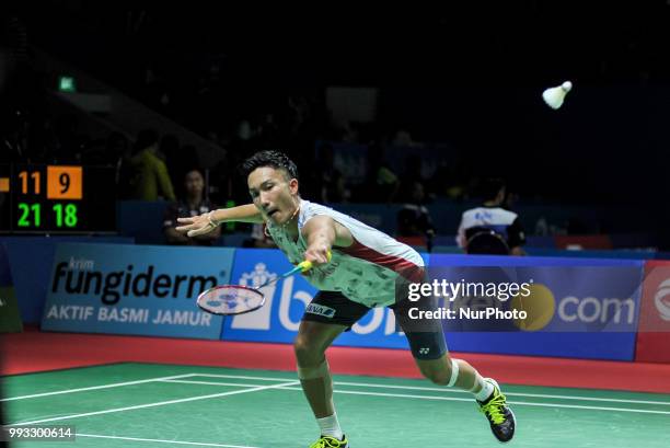 Japanese badminton player Kento Momota versus Indonesian players Tommy Sugiarto during the Men's Singles of the Blibli Indonesia Open at Istora...