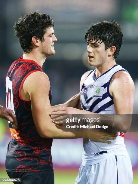 Defeated Andrew Brayshaw of the Dockers hugs brother Angus Brayshaw of the Demons during the round 16 AFL match between the Melbourne Demons and the...