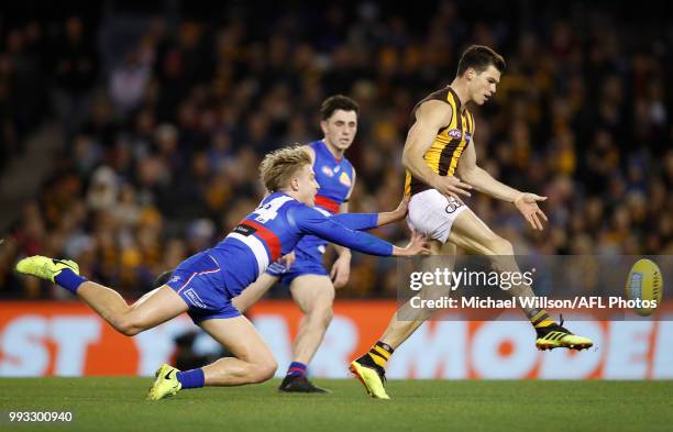 Jaeger O'Meara of the Hawks and Shane Biggs of the Bulldogs in action during the 2018 AFL round 16 match between the Western Bulldogs and the...