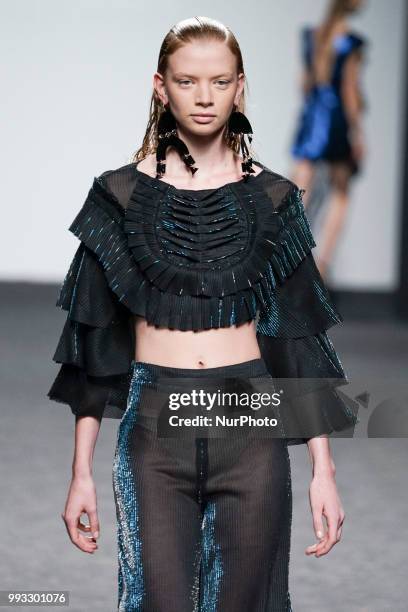 Model presents a creation by Spanish Jessica Conzen at the fashion show at the EGO Mercedes-Benz Fashion Week Madrid Spring-Summer 2019, in...