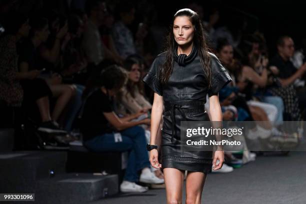 Model presents a creation by Spanish Jessica Conzen at the fashion show at the EGO Mercedes-Benz Fashion Week Madrid Spring-Summer 2019, in...