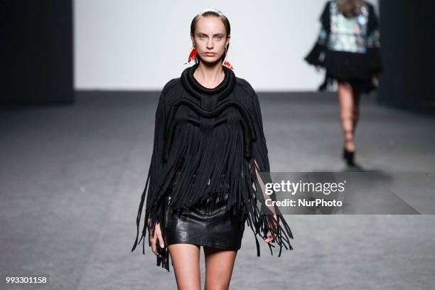 Model presents a creation by Spanish Jessica Conzen at the fashion show at the EGO Mercedes-Benz Fashion Week Madrid Spring-Summer 2019, in...