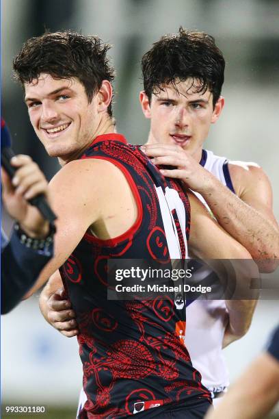 Defeated Andrew Brayshaw of the Dockers hugs brother Angus Brayshaw of the Demons during the round 16 AFL match between the Melbourne Demons and the...