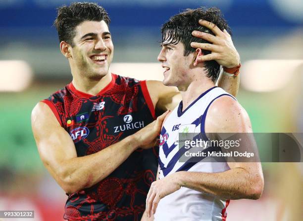 Defeated Andrew Brayshaw of the Dockers is consoled by Christian Petracca of the Demons during the round 16 AFL match between the Melbourne Demons...