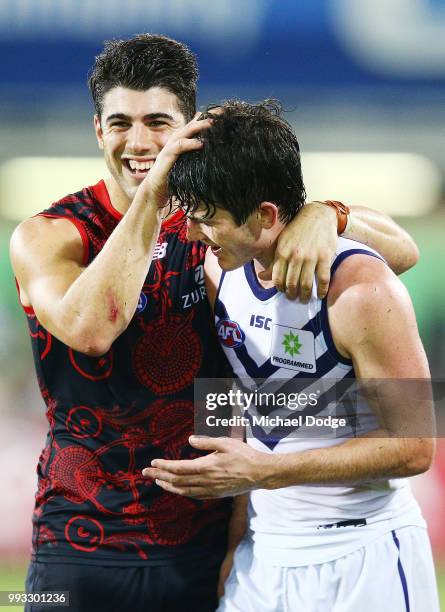 Defeated Andrew Brayshaw of the Dockers is consoled by Christian Petracca of the Demons during the round 16 AFL match between the Melbourne Demons...