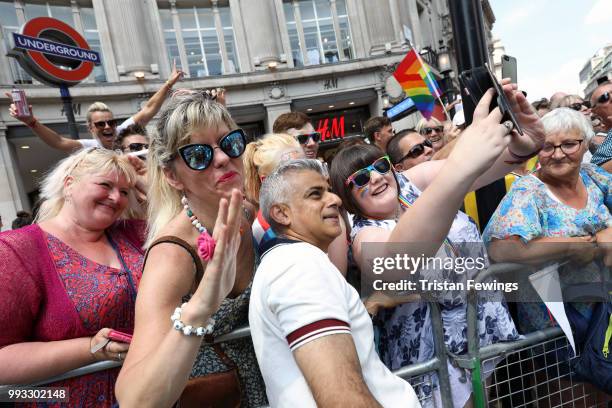 Mayor of London Sadiq Khan poses for a selfie with parade goers during Pride In London parade on July 7, 2018 in London, England. It is estimated...
