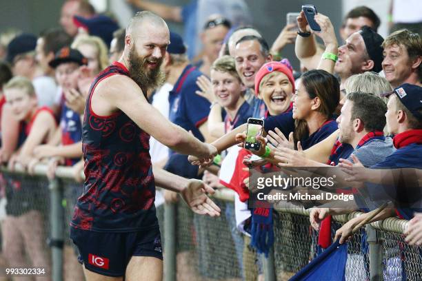 Max Gawn of the Demons celebrates the win with fans during the round 16 AFL match between the Melbourne Demons and the Fremantle Dockers at TIO...