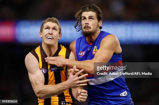 Ben McEvoy of the Hawks and Tom Boyd of the Bulldogs compete in a ruck contest during the 2018 AFL round 16 match between the Western Bulldogs and...