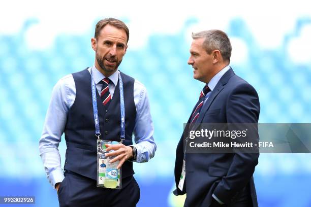 Gareth Southgate, Manager of England talks to his assistant Aidy Boothroyd during pitch inspection prior to the 2018 FIFA World Cup Russia Quarter...