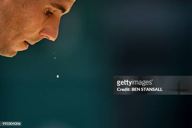 Sweat drips from the face of Spain's Rafael Nadal as he plays against Australia's Alex De Minaur during their men's singles third round match on the...