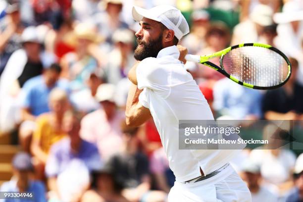 Benoit Paire of France returns a shot against Juan Martin del Potro of Argentina during their Men's Singles third round match on day six of the...