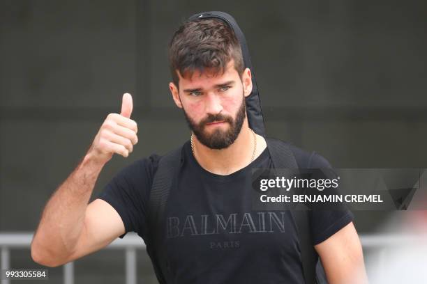 Brazil's goalkeeper Alisson leaves his team's hotel in Kazan on July 7 a day after the five-time champions crashed out of the Russia 2018 World Cup...