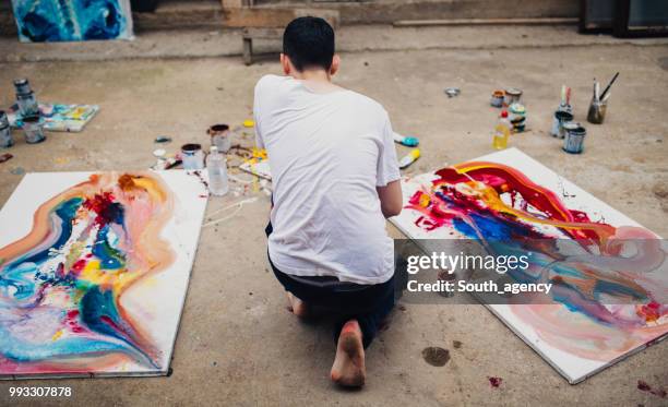 painter between paintings - painted image paintings art stock pictures, royalty-free photos & images