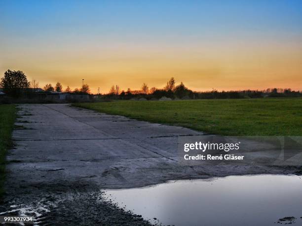 evening on a panzer road - gläser stock pictures, royalty-free photos & images