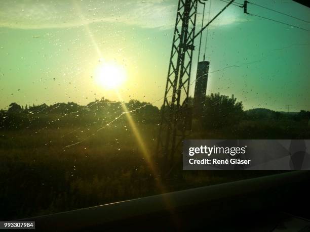 electricity pylon in the sunlight - gläser stock pictures, royalty-free photos & images