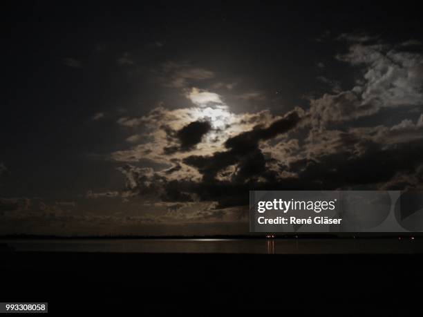 moonlight on the baltic sea - gläser stock pictures, royalty-free photos & images