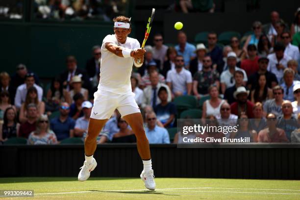 Rafael Nadal of Spain returns a shot against Alex De Minaur of Australia during their Men's Singles third round match on day six of the Wimbledon...