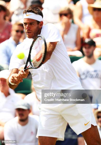 Juan Martin del Potro of Argentina returns a shot against Benoit Paire of France during their Men's Singles third round match on day six of the...