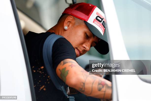 Brazil's forward Roberto Firmino leaves his team's hotel in Kazan on July 7 a day after the five-time champions crashed out of the Russia 2018 World...