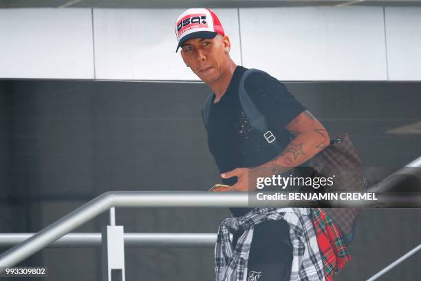 Brazil's forward Roberto Firmino leaves his team's hotel in Kazan on July 7 a day after the five-time champions crashed out of the Russia 2018 World...