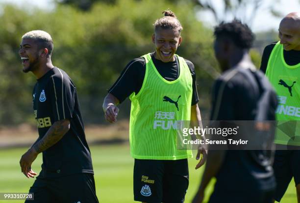 Dwight Gayle jokes with teammates during the Newcastle United Training Session at the Newcastle United Training Centre on July 7 in Newcastle upon...
