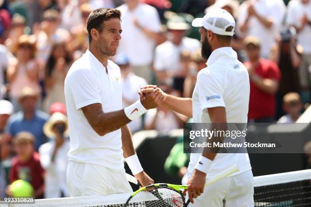 Juan Martin del Potro of Argentina shakes hands with Benoit Paire of France after their Men's Singles third round match on day six of the Wimbledon...