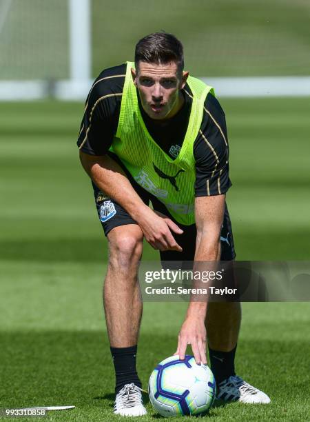 Ciaran Clark puts the ball to ground during the Newcastle United Training Session at the Newcastle United Training Centre on July 7 in Newcastle upon...