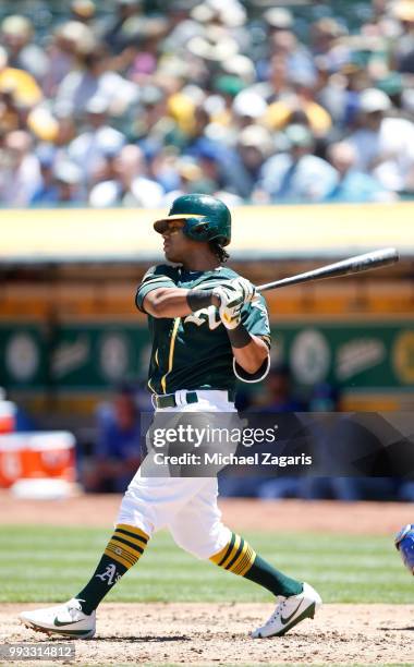 Khris Davis of the Oakland Athletics bats during the game against the Kansas City Royals at the Oakland Alameda Coliseum on June 10, 2018 in Oakland,...