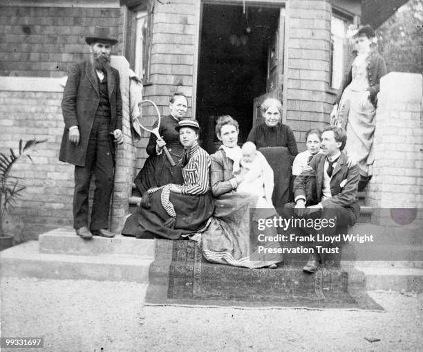 Wright family on front porch of Home, at the Frank Lloyd Wright Home and Studio, located at 951 Chicago Avenue, Oak Park, Illinois, 1890. Pictured...