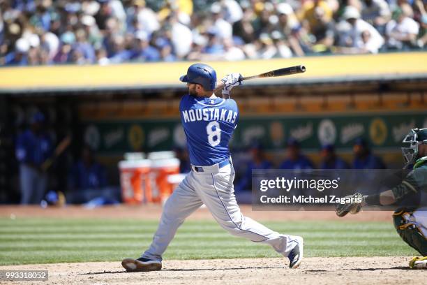 Mike Moustakas of the Kansas City Royals bats during the game against the Oakland Athletics at the Oakland Alameda Coliseum on June 10, 2018 in...