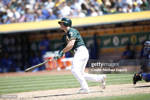 Matt Chapman of the Oakland Athletics hits a home run during the game against the Kansas City Royals at the Oakland Alameda Coliseum on June 10, 2018...