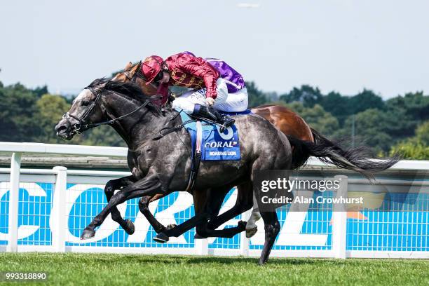 Oisin Murphy riding Roaring Lion win The Coral Eclipse from Saxon Warrior at Sandown Park on July 7, 2018 in Esher, United Kingdom.