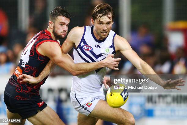 Joel Smith of the Demons competes for the ball against Joel Hamling of the Dockers during the round 16 AFL match between the Melbourne Demons and the...