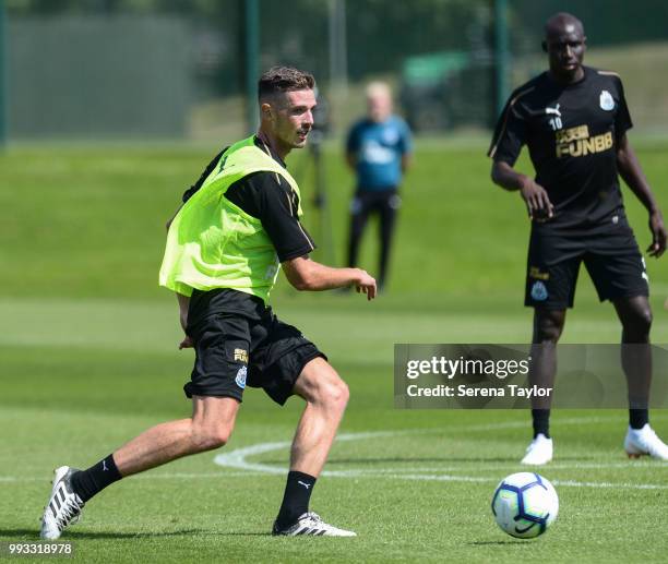 Ciaran Clark passes the ball during the Newcastle United Training Session at the Newcastle United Training Centre on July 7 in Newcastle upon Tyne,...