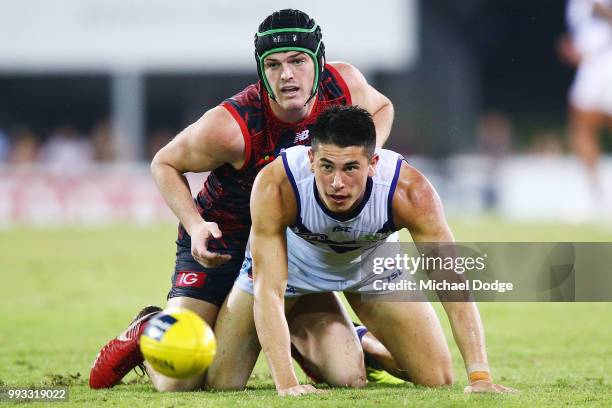 Angus Brayshaw of the Demons tackles Bailey Banfield of the Dockers during the round 16 AFL match between the Melbourne Demons and the Fremantle...