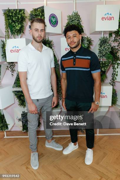 Matt Gordon and Alex Oxlade- Chamberlin attend the evian Live Young Suite at The Championship at Wimbledon on July 7, 2018 in London, England.