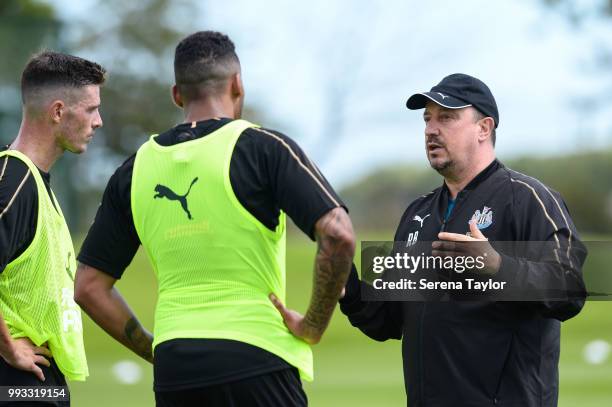 Newcastle United Manager Rafael Benitez speaks to Ciaran Clark and Jamaal Lascelles during the Newcastle United Training Session at the Newcastle...